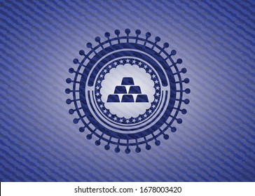 gold bullion icon inside badge with denim background