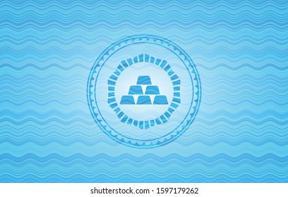 gold bullion icon inside sky blue water wave style badge.