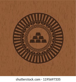 gold bullion icon inside wood emblem