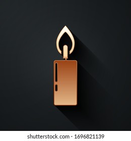 Gold Burning candle icon isolated on black background. Cylindrical candle stick with burning flame. Long shadow style. Vector Illustration