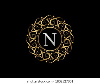 Gold Calligraphic Badge with Letter N Design. Ornamental luxury golden logo design vector illustration.