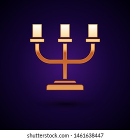 Gold Candlestick icon isolated on dark blue background.  Vector Illustration