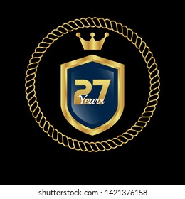 Gold celebration shield. 27 years anniversary
