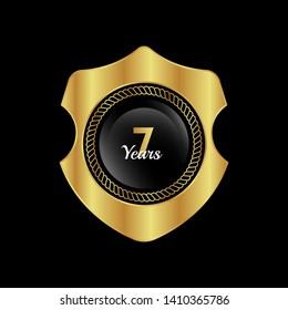 Gold celebration shield. 7 years anniversary.