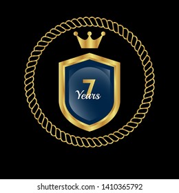 Gold celebration shield. 7 years anniversary.