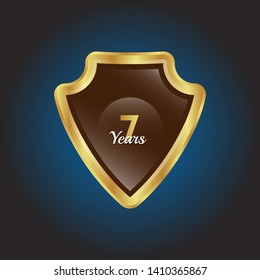 Gold celebration shield. 7 years anniversary.