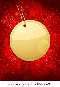 gold Christmas gift tag taped to a glowing red background