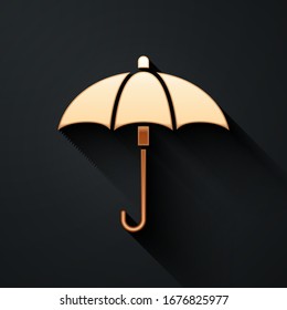 Clásico de oro elegante abrir icono de paraguas aislado en fondo negro. Símbolo de protección contra la lluvia. Estilo de sombra largo.  Ilustración vectorial