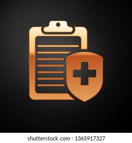 Gold Clipboard with medical insurance icon isolated on black background. Patient protection. Clipboard and shield with a cross as a symbol insurance. Vector Illustration