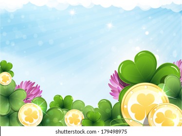 Gold coins and clover on a blue sky background.  St. Patrick's Day background.