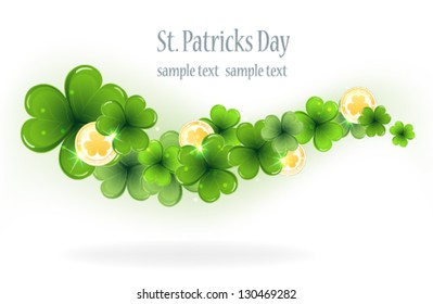Gold coins and clover on a white background.  St. Patrick's Day symbol.
