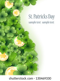 Gold coins and clover on a white background.  St. Patrick's Day background.