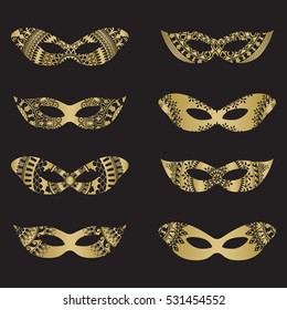 Gold color masquerade mask silhouettes with decorative elements on black background