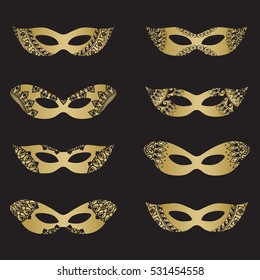 Gold color masquerade mask silhouettes with decorative elements on black background