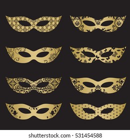 Gold color masquerade mask silhouettes with decorative elements on black background