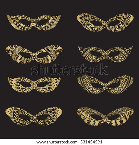 Gold color masquerade mask silhouettes with decorative elements on black background