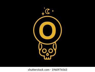 Gold color on dark background of O initial letter in skull circle