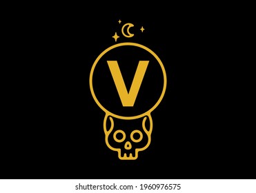 Gold color on dark background of V initial letter in skull circle