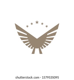 Gold colored wings on white background. Abstract wings and star shapes.