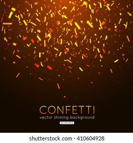 Gold confetti on dark background. Vector eps 10 format.