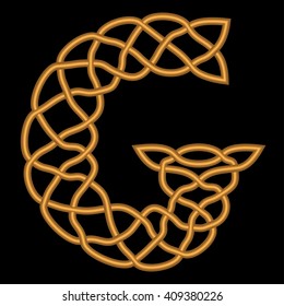 Gold or copper retro letter G is shown in a rich historic Gothic, Celtic and Arabic, oriental style with patterns, weaves, knots and ornaments on a black background.