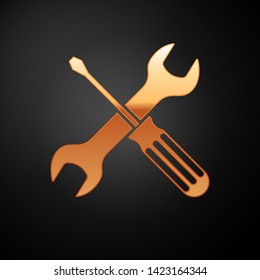 Gold Crossed screwdriver and wrench tools icon isolated on black background. Service tool symbol.  Vector Illustration