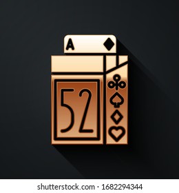 Gold Deck of playing cards icon isolated on black background. Casino gambling. Long shadow style. Vector Illustration