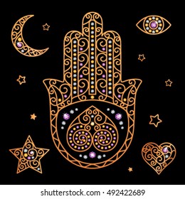 gold decorative elements with jewels on a black background