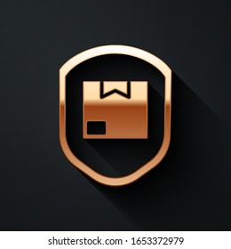 Gold Delivery pack security with shield icon isolated on black background. Delivery insurance. Insured cardboard boxes beyond the shield. Long shadow style. Vector Illustration
