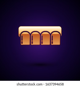 Gold Dentures model icon isolated on dark blue background. Teeth of the upper jaw. Dental concept.  Vector Illustration