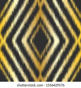 Gold diamond ikat seamless repeat vector pattern swatch on black background. Golden gradient. Tribal blurry fuzzy design.