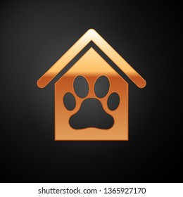 Gold Dog house and paw print pet icon isolated on black background. Dog kennel. Vector Illustration