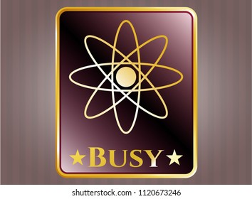  Gold emblem with atom icon and Busy text inside