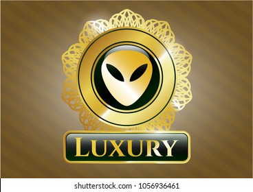  Gold emblem or badge with alien icon and Luxury text inside