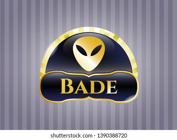 Gold emblem or badge with alien icon and Bade text inside