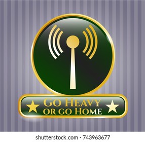  Gold emblem or badge with antenna signal icon and Go Heavy or go Home text inside