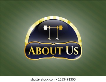  Gold emblem or badge with barbell on rack icon and About Us text inside