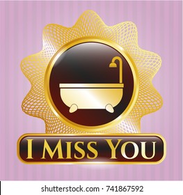  Gold emblem or badge with bathtub icon and I Miss You text inside