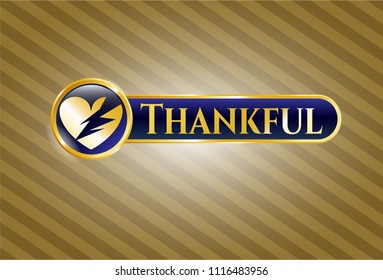  Gold emblem or badge with broken heart icon and Thankful text inside