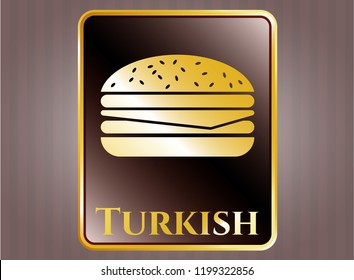  Gold emblem or badge with cheeseburger icon and Turkish text inside