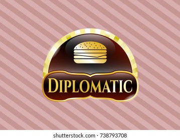  Gold emblem or badge with cheeseburger icon and Diplomatic text inside