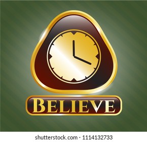   Gold emblem or badge with clock, time icon and Believe text inside