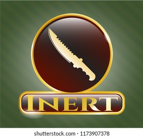  Gold emblem or badge with combat knife icon and Inert text inside