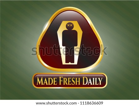  Gold emblem or badge with dead man in his coffin icon and Made Fresh Daily text inside