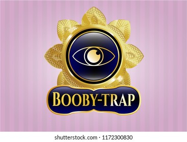  Gold emblem or badge with eye icon and Booby-trap text inside