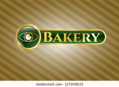  Gold emblem or badge with eye icon and Bakery text inside