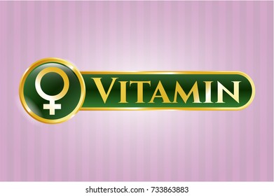  Gold emblem or badge with female icon and Vitamin text inside