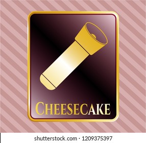  Gold emblem or badge with flashlight icon and Cheesecake text inside