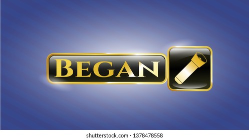  Gold emblem or badge with flashlight icon and Began text inside