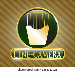  Gold emblem or badge with fries icon and Cine-camera text inside